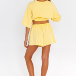 Yellow lounge shorts with drawstring waist and blue CW logo detail - pockets – back view