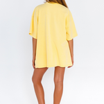 Yellow oversized lounge tee with blue CW logo – back view