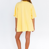 Yellow oversized lounge tee with blue CW logo – back view