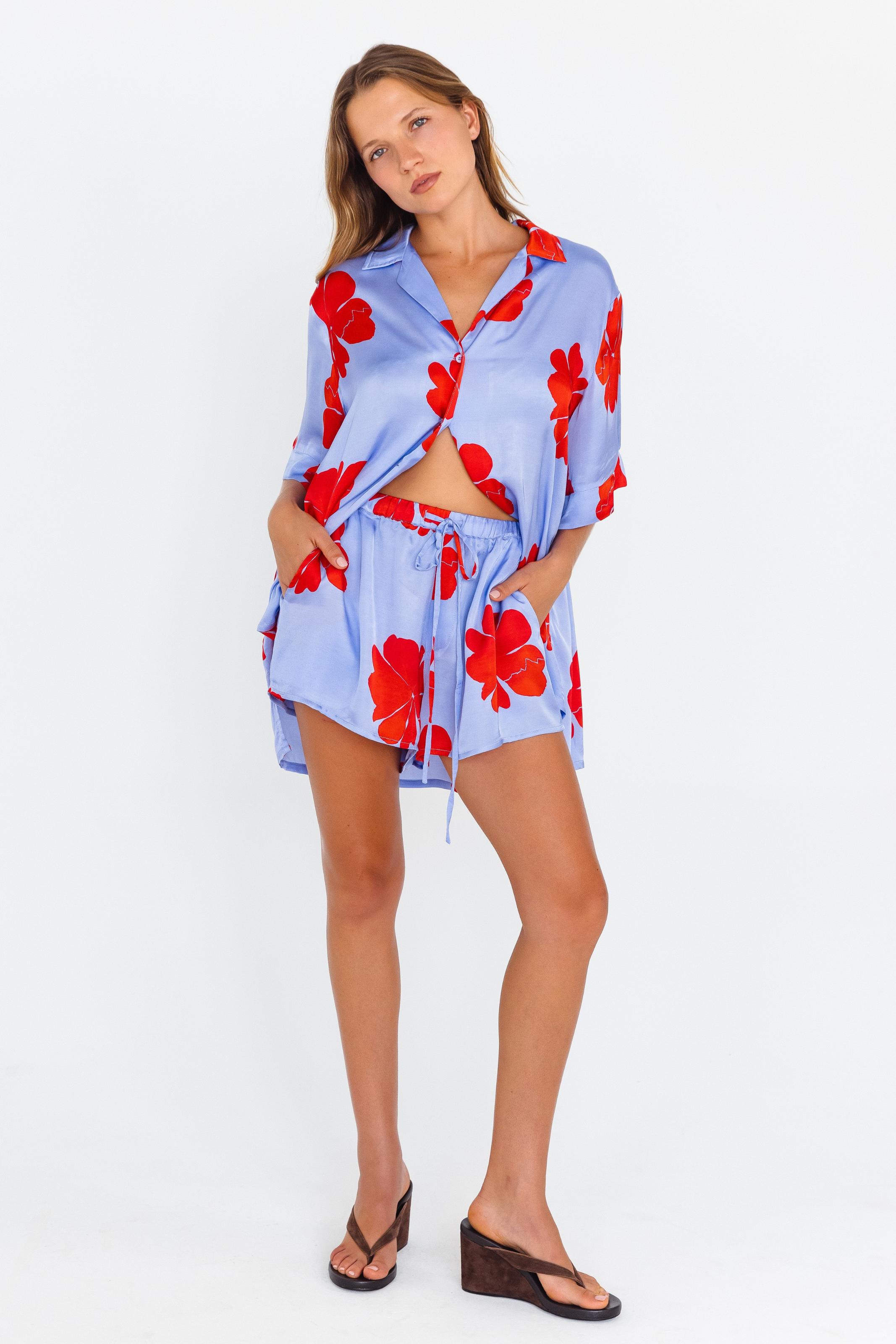 Lilac floral shorts with ruby hibiscus print and drawstring waist – front view