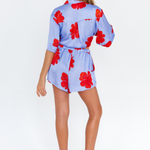 Hibiscus Haze lilac floral shorts with side pockets – back view