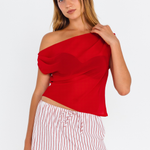 Red off-shoulder fitted top – front view worn with white striped mini skirt - close up image